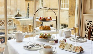 An afternoon tea at the Pump Room Restaurant, featuring scones, cakes, and sandwiches