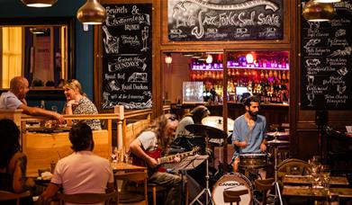 A band playing in the restaurant at Green Park Brasserie