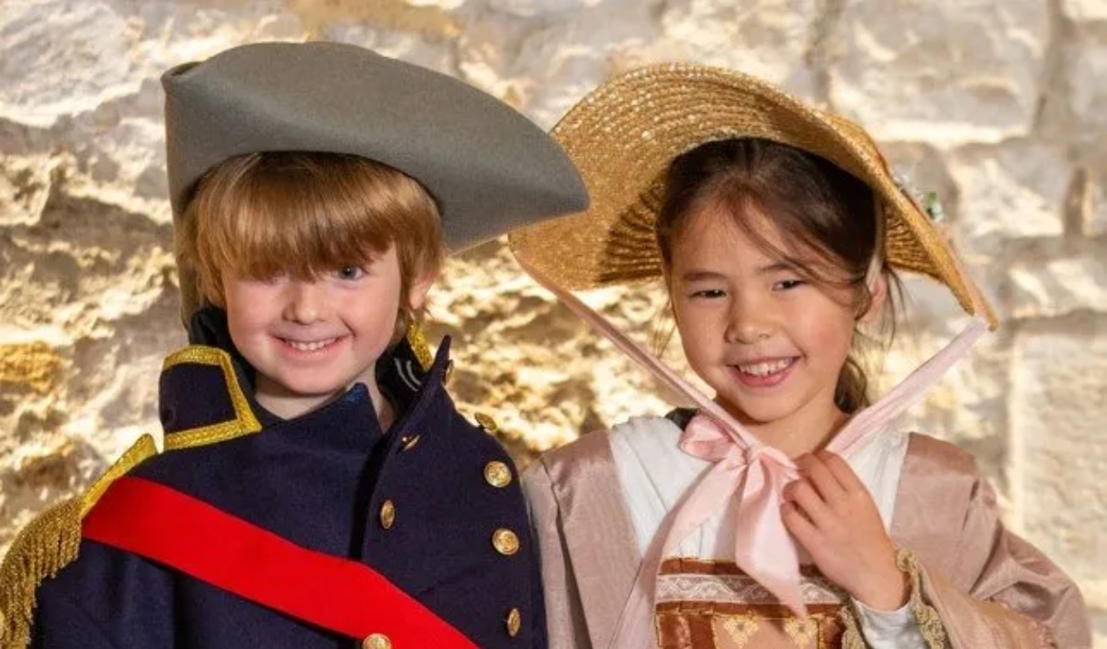 2 children dressed up in regency wear