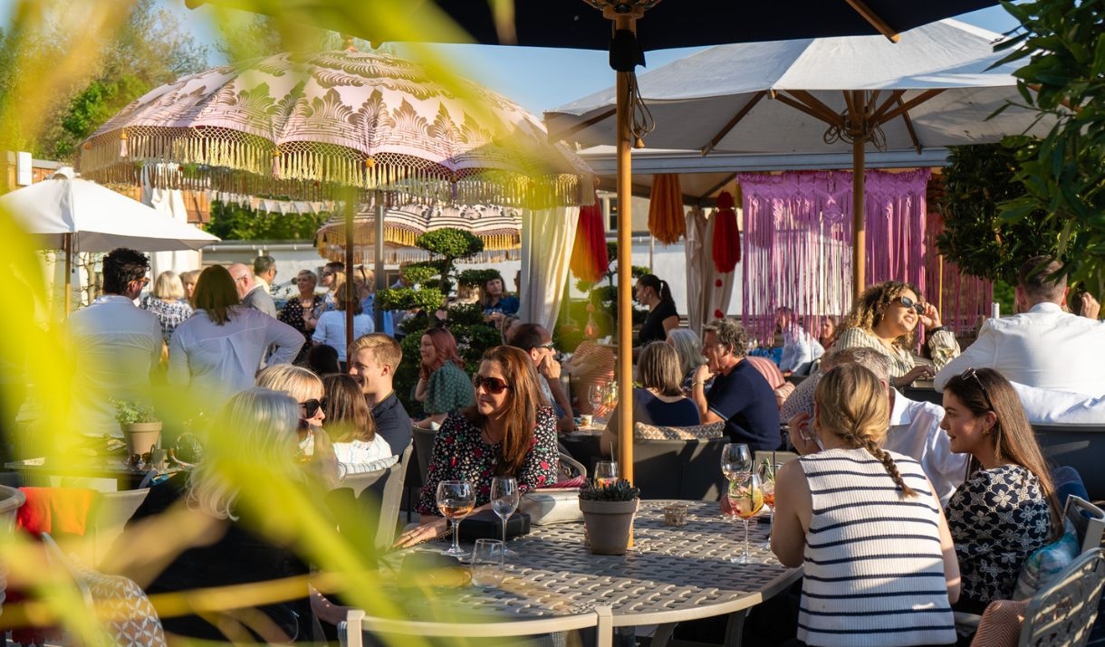 People sat outside on restaurant terrace