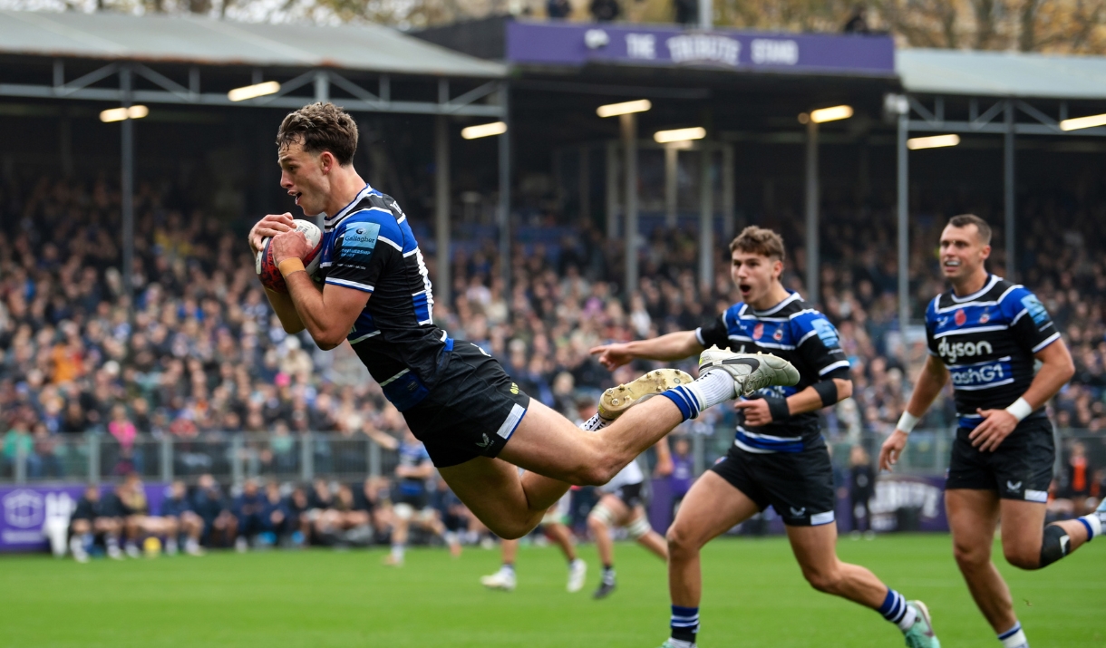 Louie Hennessey of Bath Rugby dives to score a try in the first half.