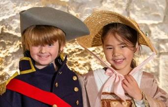 2 children dressed up in regency wear