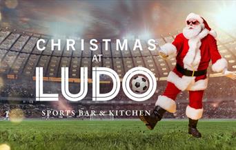 Christmas at Ludo with Santa kicking at football