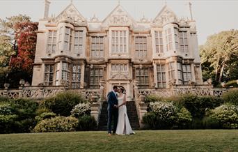 The married couple in front of the Hall