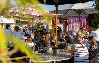 People sat outside on restaurant terrace