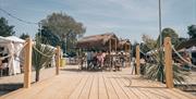 Decking area with seating shacks for visitors