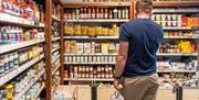 Man looking at shop produce