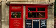 Red door and window on building