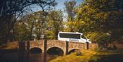 Rabbies bus driving over bridge