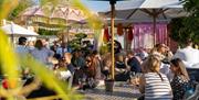 People sat outside on restaurant terrace