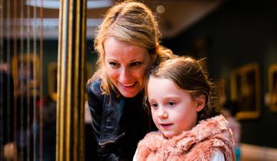 Mother with daughter in a museum in Bath